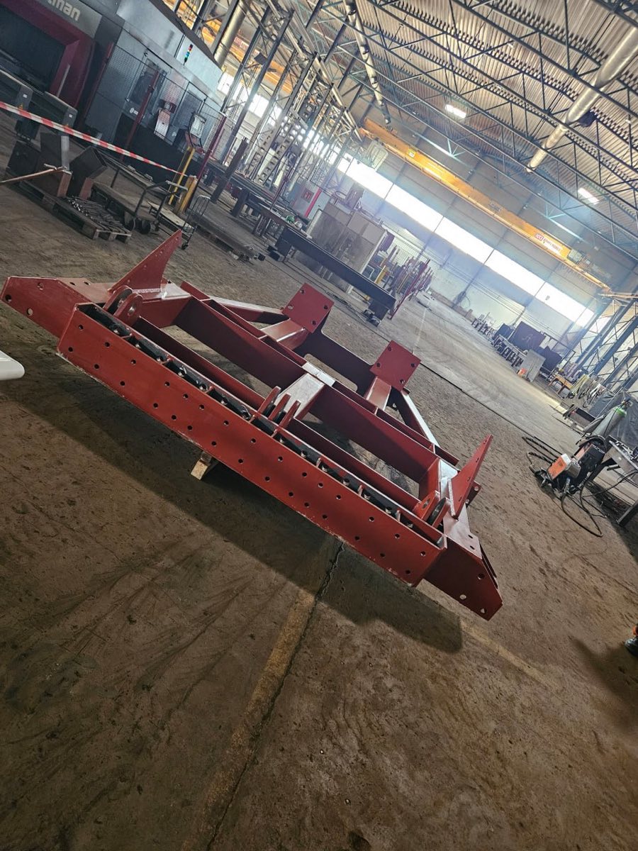 Welded frame assembly with primer coating
